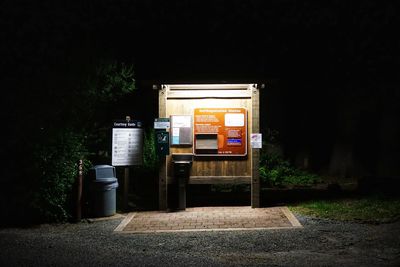 Information sign on field at night