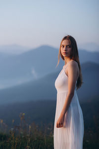 Young woman standing outdoors