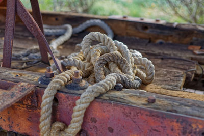 Close-up of rope tied on rusty metal