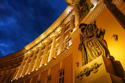 Low angle view of building against cloudy sky