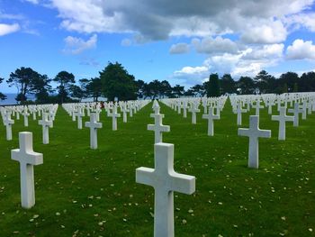 Row of cemetery against sky