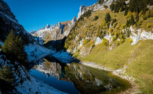 Reflection of the mountains in the faelensee from the mountain inn bollenwees