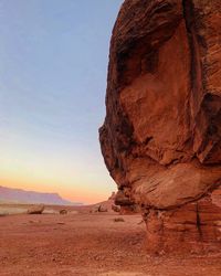 Rock formation in desert against sky