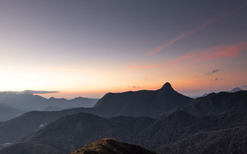 Scenic view of silhouette mountains against sky during sunset