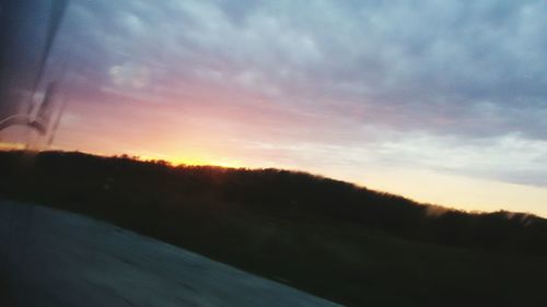 Silhouette landscape against sky during sunset