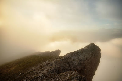 Rocks on mountain against sky