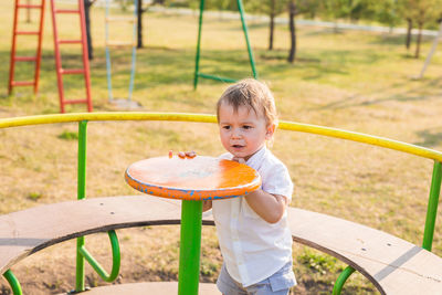 Portrait of boy playing in playground