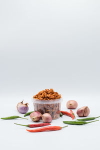 Food on table against white background