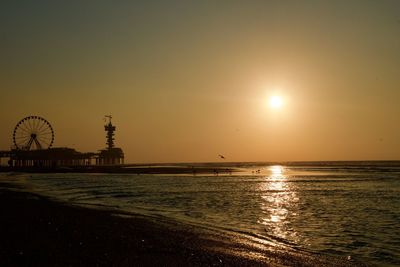 Scenic view of sea against sky at sunset