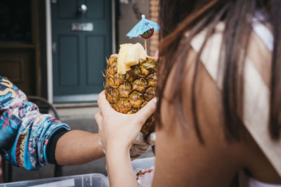 Midsection of woman holding ice cream