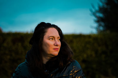 Portrait of woman against sky