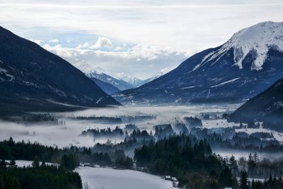 Scenic view of snowcapped mountains against sky