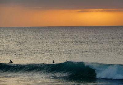 Scenic view of sea against sky during sunset