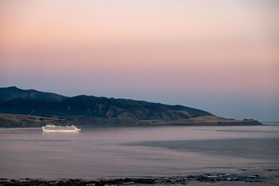 Scenic view of sea against sky at sunset