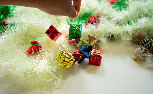 Midsection of man holding christmas decorations