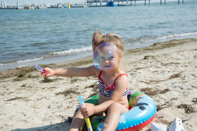 Girl playing on beach