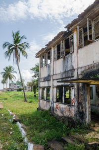 Abandoned ruined building against sky, robertsport, liberia