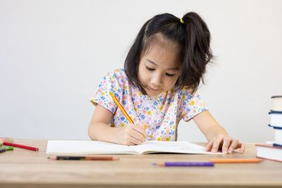 Girl studying at table