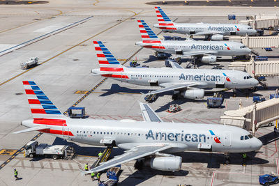 High angle view of airplane on airport runway