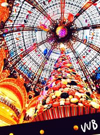 Low angle view of illuminated ferris wheel