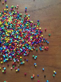 High angle view of multi colored candies on table