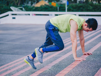 Side view of boy skateboarding on skateboard