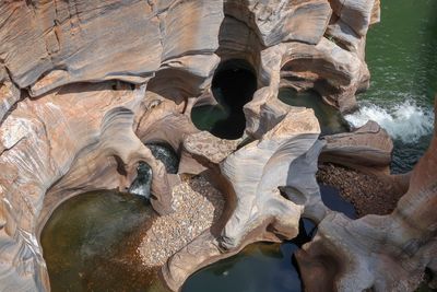 High angle view of rock formations at coastline