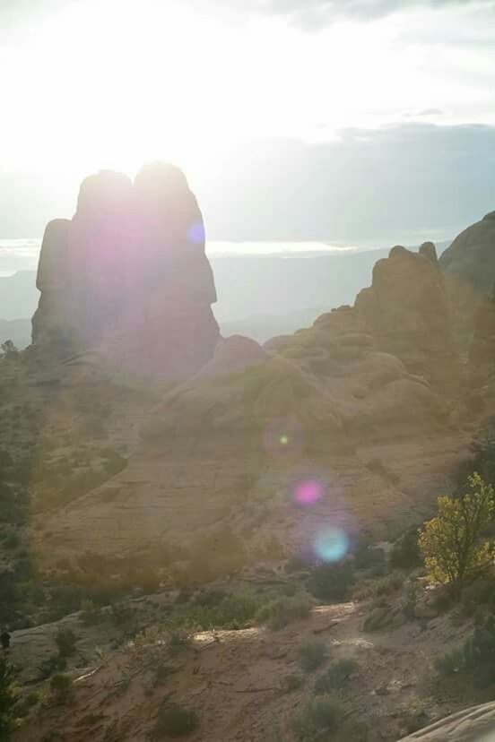 tranquil scene, tranquility, rock formation, scenics, rock - object, beauty in nature, sky, nature, sun, landscape, lens flare, sunlight, idyllic, non-urban scene, cliff, mountain, rock, sea, sunbeam, remote