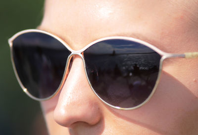 Close-up of young woman wearing sunglasses