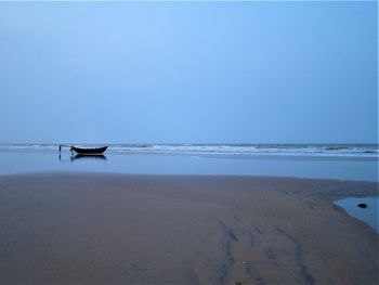 Scenic view of beach against clear sky