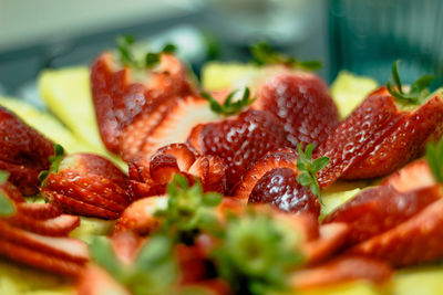 Close-up of chopped fruits in plate