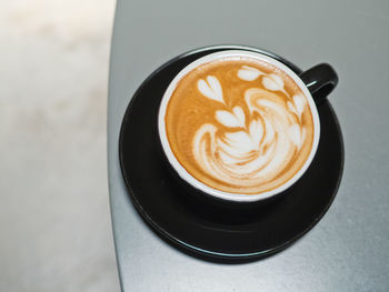 High angle view of cappuccino on table