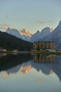 Scenic view of lake and mountains against sky