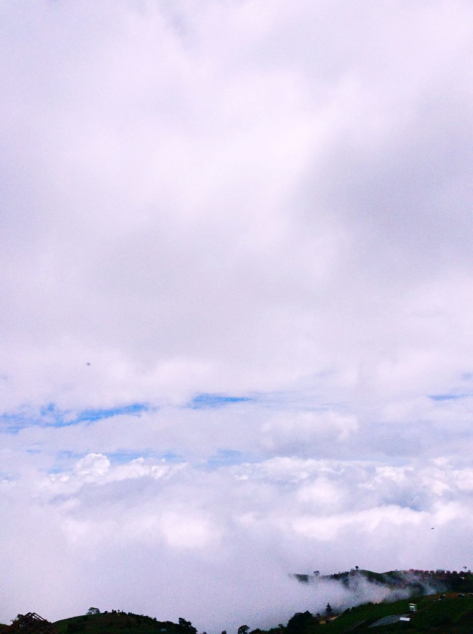 sky, cloud - sky, tranquil scene, scenics, tranquility, cloudy, beauty in nature, weather, nature, landscape, cloud, overcast, idyllic, cloudscape, non-urban scene, outdoors, low angle view, day, no people, tree