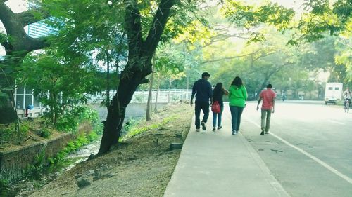 Full length of woman walking on footpath