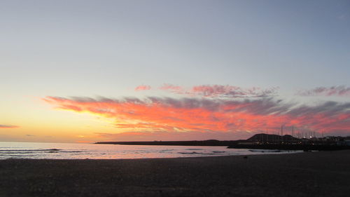 Scenic view of calm sea at sunset