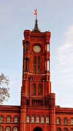 Low angle view of clock tower against sky