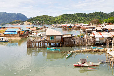 Panoramic view of townscape and mountains against sky