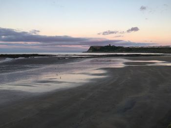 Scenic view of sea at sunset