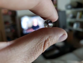 Cropped hand holding marble