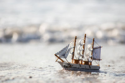 Close-up of ship on beach