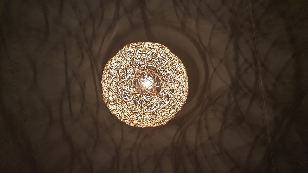 LOW ANGLE VIEW OF ILLUMINATED CHANDELIER