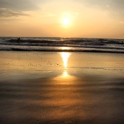 Scenic view of sea at sunset