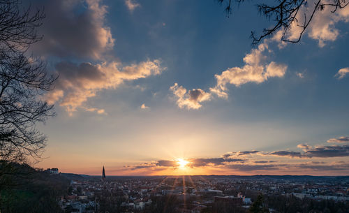 Aerial view of townscape against sky during sunset