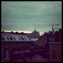 Low angle view of building against cloudy sky