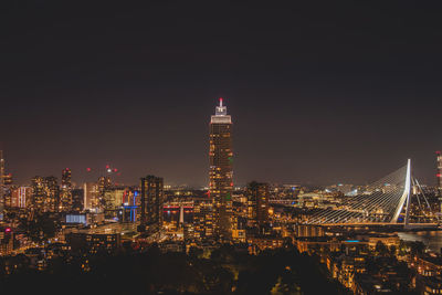 Illuminated buildings in city at night