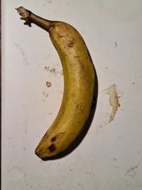 Directly above shot of banana against white background