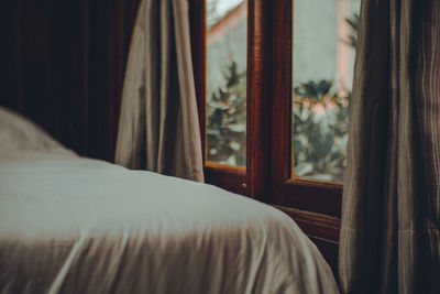 Close-up of curtain on window at home