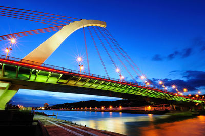 Low angle view of bridge against sky at night