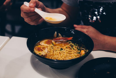 Close-up of man preparing food